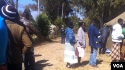 Voters waiting to cast their votes in Zimbabwe's general election Wednesday