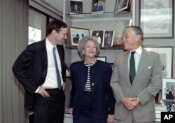 A May 8, 1991 photo shows Katharine Graham, Chairman of the Washington Post poseingwith her son publisher Donald Graham (L) and Ben Bradlee, executive editor of the post, in her office in New York City.