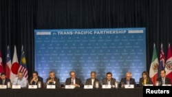 FILE - The 12 Trans-Pacific Partnership (TPP) Ministers hold a press conference to discuss progress in the negotiations in Lahaina, Maui, Hawaii, July 31, 2015. 