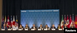 FILE - The 12 Trans-Pacific Partnership (TPP) Ministers hold a press conference to discuss progress in the negotiations in Lahaina, Maui, Hawaii, July 31, 2015.