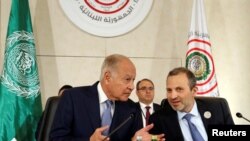 Arab League Secretary-General Ahmed Abul Gheit gestures as he talks with Lebanese Foreign Minister Gebran Bassil, at a pre Arab Economic and Social Development summit meeting in Beirut, Lebanon January 18, 2019.