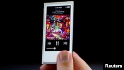 FILE : The new iPod Nano is introduced during Apple Inc.'s iPhone media event in San Francisco, California, Sept. 12, 2012.