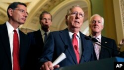 From left, Sen. John Barrasso, R-Wyo., Sen. John Thune, R-S.D., Senate Majority Leader Mitch McConnell of Ky., and Senate Majority Whip John Cornyn of Texas, participate in a news conference on Capitol Hill in Washington, Nov. 16, 2016.