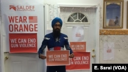 Vishavjit Singh, who dresses up as Sikh Captain America, poses to speak out against gun violence.