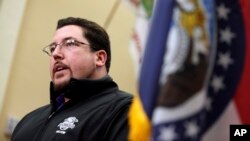 Ferguson, Mo., Mayor James Knowles, shown announcing the resignation of Police Chief Thomas Jackson at news conference on March 11, says it will up to voters to remove him from the part-time job.