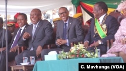 Presidents Edgar Lungu of Zambia, Cyril Ramaphosa of South Africa, and Rwanda’s Paul Kagame – the African Union chairperson – shares a lighter moment with Zimbabwe’s newly sworn in Emmerson Mnangagwa, Aug. 26, 2018, in Harare. 
