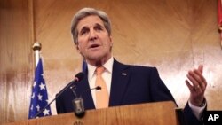 FILE - Secretary of State John Kerry is shown at a news conference in Amman, Jordan, Feb. 21, 2016. The secretary is seeking more information before determining whether atrocities committed by Islamic State constitute genocide.
