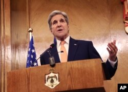 Secretary of State John Kerry gestures during a joint press conference with his Jordanian counterpart Nasser Judeh (unseen) in Amman, Jordan, Feb. 21, 2016.
