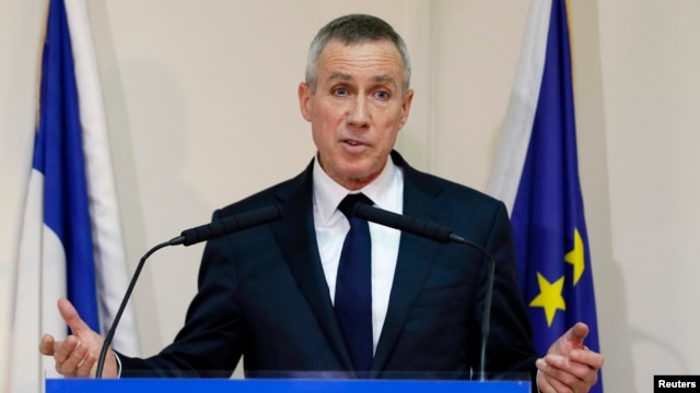 FILE - Prosecutor Francois Molins speaks to reporters in Paris after it was learned that French national Maxime Hauchard was among Islamic State members filmed as they executed Syrian soldiers, Nov. 17, 2014.
