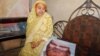With the photo of Habibur Rahman, his mother sits in her Chittagong home a day after he was killed May 18 in the ongoing anti-drug campaign in Bangladesh. Family members of Rahman insist that he was a religious man and had had no connection with narcotics.