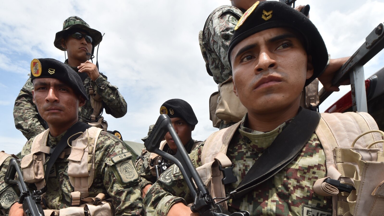 FILE - Peruvian military and police get ready during an operation against illegal mining, Feb. 19, 2019, in the Amazon jungle over the river basin of the Madre de Dios region, in southeast Peru.