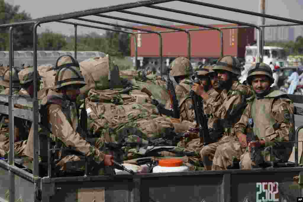 Pakistan Army troops leave Karachi, Pakistan heading for an earthquake-affected area in the Baluchistan province, Sept. 25, 2013. 