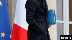 A French official leaves a cabinet meeting at the Elysee Palace in Paris, France, May 10, 2016. "We will no longer keep quiet," seventeen female former French government ministers wrote in an op-ed condemning sexual misconduct in politics.
