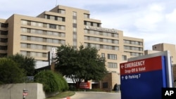Texas Health Presbyterian Hospital Dallas, where U.S. Ebola patient Thomas Eric Duncan was being treated, Wednesday, Oct. 8, 2014, in Dallas. The hospital said Wednesday that Duncan has died. (AP Photo/LM Otero)