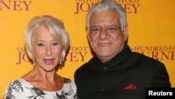 Cast members Helen Mirren and Om Puri arrive for the British gala screening of "The Hundred-Foot Journey" in London, Sept. 3, 2014. 