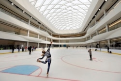 Sabrina Piliero, with World Ice Events, practices on the rink at the American Dream mega entertainment and shopping complex in East Rutherford, N.J., Friday, Oct. 25, 2019. (AP Photo/Richard Drew)