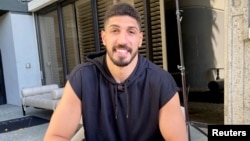 FILE - Boston Celtics center Enes Kanter poses for a photo during an interview with Reuters, in Los Angeles, California, August 6, 2021.