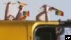 FILE - People wave gay pride flagsfrom a double-decker bus during an annual Gay Pride march in Johannesburg, South Africa, Sept. 30, 2006. South Africa is seen as the most tolerant country on the African continent when it comes to LGBT rights.