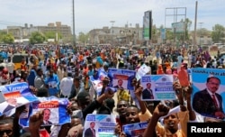 Civilians celebrate the election of President Mohamed Abdullahi Mohamed in the streets of Somalia's capital Mogadishu, Feb. 9, 2017.