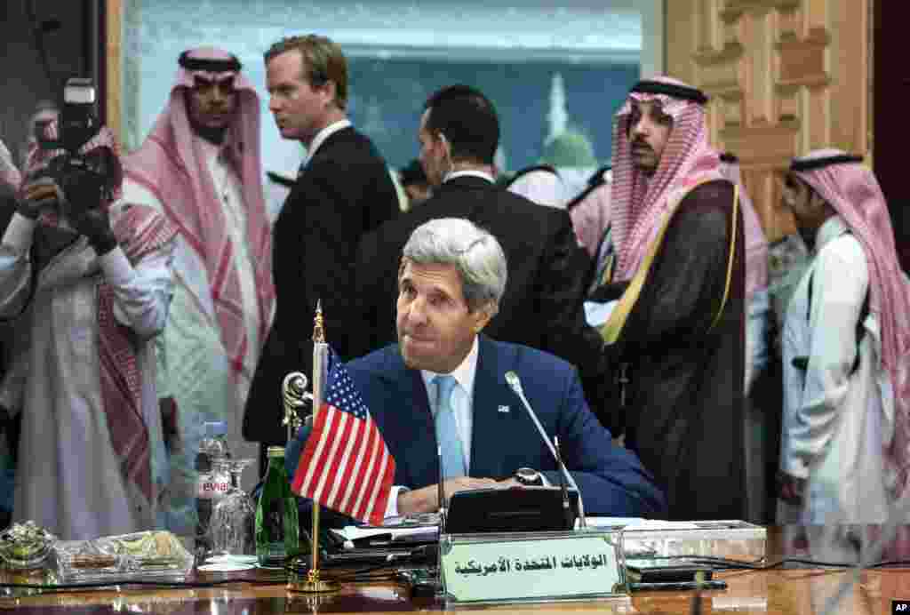 U.S. Secretary of State John Kerry waits for the start of a meeting of the Gulf Arab region, in Jeddah, Saudi Arabia, Sept. 11, 2014.