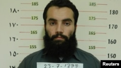 FILE - Anas Haqqani, a senior leader of the Haqqani network, arrested by the Afghan Intelligence Service (NDS) in Khost province is seen in this handout picture released Oct. 16, 2014.
