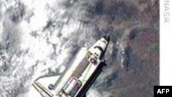 فضاپيمای ديسکاوری آمريکا در کنار ايستگاه فضايی بين المللی پهلو گرفت