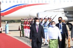 FILE - Myanmar Foreign Minister Wunna Maung Lwin welcomes Cambodian Prime Minister Hun Sen in Naypyitaw, Myanmar, Jan. 7, 2022.