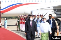 FILE - Myanmar Foreign Minister Wunna Maung Lwin welcomes Cambodian Prime Minister Hun Sen in Naypyitaw, Myanmar, Jan. 7, 2022.