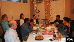 Chanda Choun talks to his campaign team and friends during a post-election gathering at a supporter's house in Arlington, Va., June 12, 2018. The first-time Cambodian-American hopeful received 4,589 votes or 39% in Arlington's primaries but lost to Democratic rival Matt de Ferranti, who received over 60% with 7,075 votes. (Sophat Soeung/VOA Khmer)