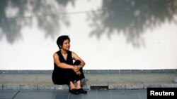 FILE - Filmmaker Tan Pin Pin poses during a 2007 photo shoot with Reuters in Singapore.