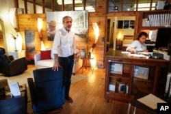 Michael Koveleski speaks during an interview alongside his wife, Margery, at their store Design Sleep in Yellow Springs, Ohio, Aug. 23, 2018.