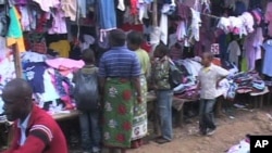 Shoppers look for second-hand clothing called 'mitumba' at Toi Market in Nairobi, Kenya