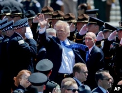 President Donald Trump waves as he leaves after speaking at the 36th Annual National Peace Officers memorial service, May 15. 2017, on Capitol Hill in Washington.