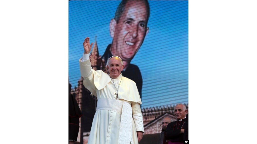Pope Francis waves as he leaves after a meeting with youths in Piazza Politeama, in Palermo, southern Italy, Sept. 15, 2018. The pontiff was paying tribute in Sicily to a priest, the Rev. Giuseppe "Pino" Puglisi, who worked to keep youths away from the Mafia and was slain by mobsters, on the 25th anniversary of his assassination.