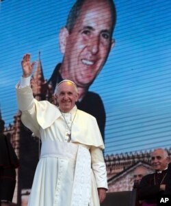 Pope Francis waves as he leaves after a meeting with youths in Piazza Politeama, in Palermo, southern Italy, Sept. 15, 2018. The pontiff was paying tribute in Sicily to a priest, the Rev. Giuseppe "Pino" Puglisi, who worked to keep youths away from the Mafia and was slain by mobsters, on the 25th anniversary of his assassination.