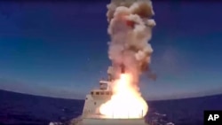 In this frame grab provided May 31, 2017 by Russian Defense Ministry press service, long-range Kalibr cruise missile is launched by the Russian Navy Admiral Essen frigate in the Mediterranean. 