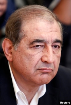 Syrian Deputy Prime Minister for Economic Affairs Qadri Jamil listens during a meeting with Russian Foreign Minister Sergei Lavrov in Moscow, July 22, 2013.