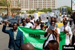 Demonstrators marching in Lagos Monday.