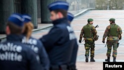 Belgian soldiers patrol outside the European Council headquarters in central Brussels, Jan, 21, 2015. 