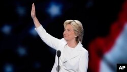 FILE - Democratic presidential nominee Hillary Clinton waves to delegates before speaking during the final day of the Democratic National Convention in Philadelphia, July 28, 2016.