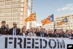 Catalan mayors protest outside the European Commission headquarters in support of the ousted Catalan government in Brussels, Belgium, Nov. 7, 2017.