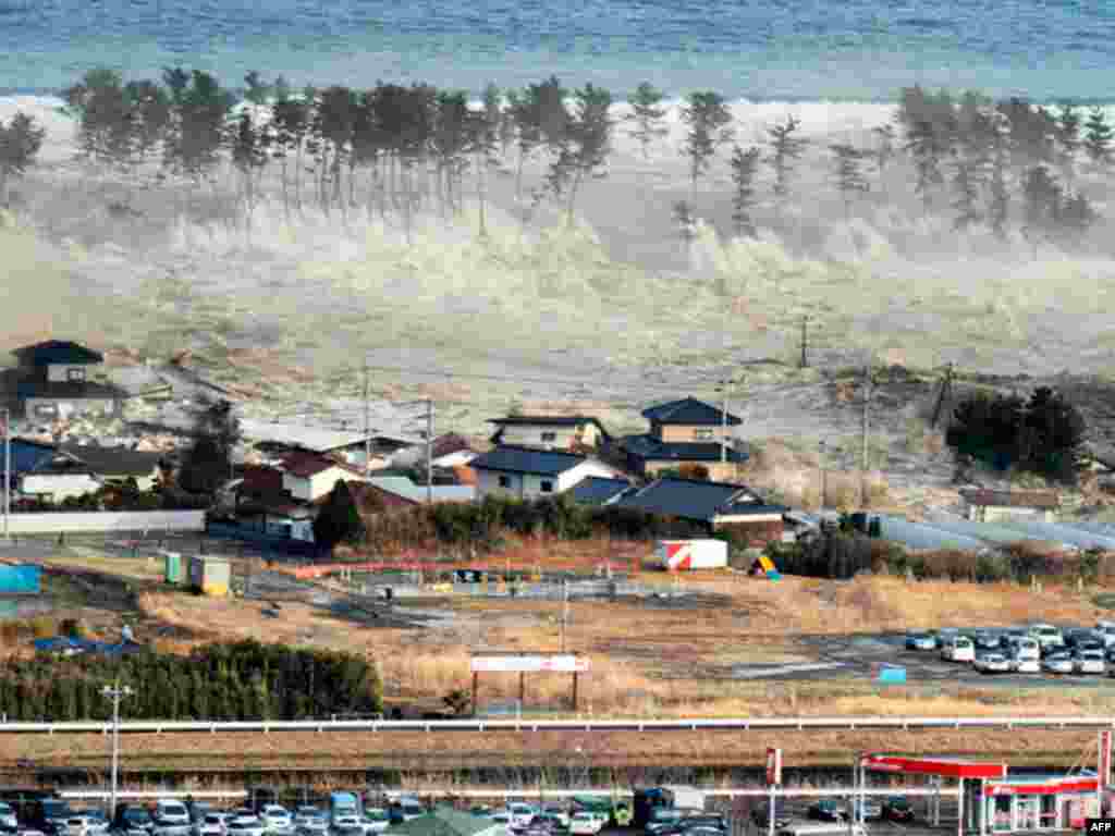 A massive tsunami sweeps in to engulf a residential area after a powerful earthquake in Natori, Miyagi Prefecture in northeastern Japan March 11, 2011. The biggest earthquake to hit Japan in 140 years struck the northeast coast on Friday, triggering a 10-