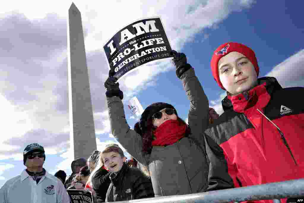 Thousands of people rally on the National Mall before the start of the 44th annual March for Life in Washington, D.C. The march is a gathering and protest against the United States Supreme Court's 1973 Roe v. Wade decision legalizing abortion.