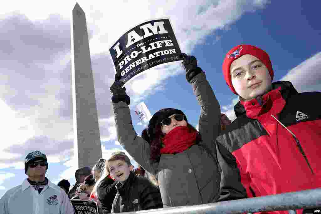 Thousands of people rally on the National Mall before the start of the 44th annual March for Life in Washington, D.C. The march is a gathering and protest against the United States Supreme Court&#39;s 1973 Roe v. Wade decision legalizing abortion.