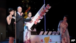 A clapperboard is held at the start of the opening ceremony of the 14th Pyongyang International Film Festival at the Ponghwa Art Theatre in Pyongyang, North Korea, Sept. 17, 2014.