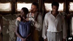 This image released by Fox Searchlight shows Lupita Nyong’o, from left, Michael Fassbender and Chiwetel Ejiofor in a scene from "12 Years A Slave." 