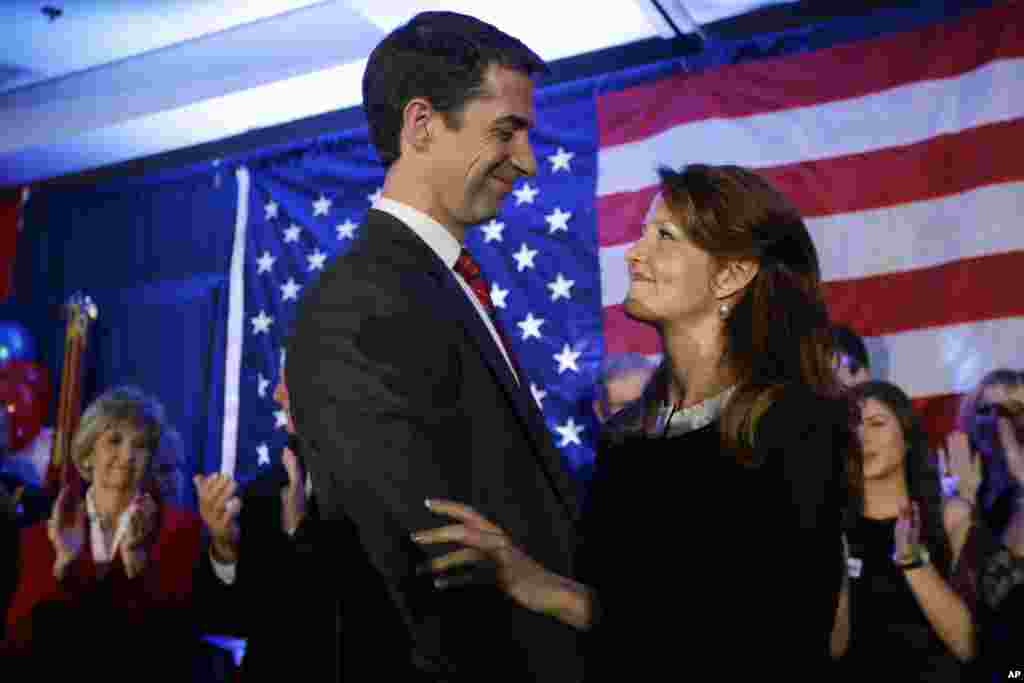 In Arkansas, Republican Rep. Tom Cotton hugs wife Anna at his election watch party in North Little Rock before defeating incumbent Senator Mark Pryor, Nov. 4, 2014.