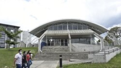 Students walks past the Solar Astronomical Observatory in San Jose, Costa Rica, Friday, April 30, 2021. Costa Rica approved a law creating a space agency on Feb. 18. (AP Photo/Carlos Gonzalez)