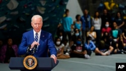 President Joe Biden speaks at Sportrock Climbing Centers, Friday, May 28, 2021, in Alexandria, Va. (AP Photo/Evan Vucci)