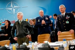 NATO commanders await the start of the NATO Ministerial Meeting on the South, Partnerships, and Defense Capacity at NATO Headquarters in Brussels, Dec. 1, 2015.